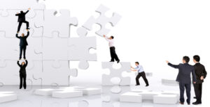 business team work building a puzzle isolated over a white background.